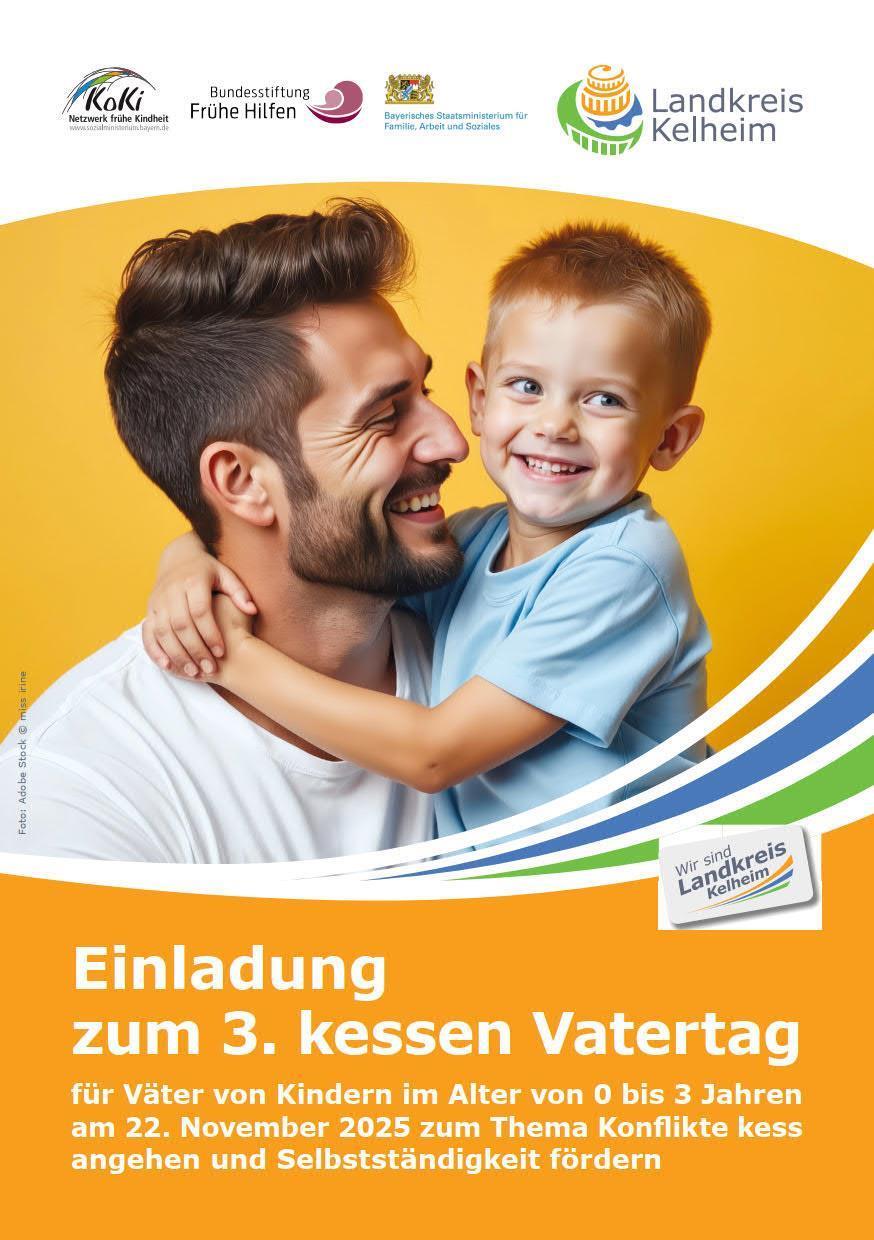 Vater mit Sohn auf dem Arm umarmend