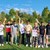 Landrat Martin Neumeyer mit zehn jungen Männern auf dem Cricket-Feld.
