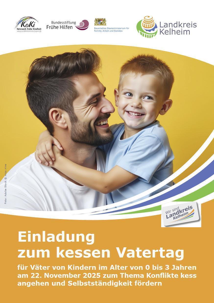 Vater mit Sohn auf dem Arm umarmend